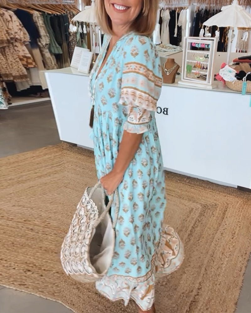 Chic Floral V-Neck Dress with Flattering Fit and Flowing Design