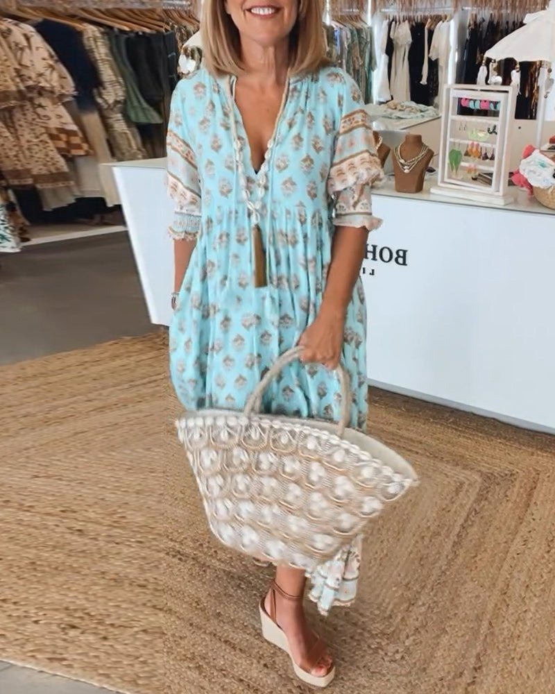 Chic Floral V-Neck Dress with Flattering Fit and Flowing Design