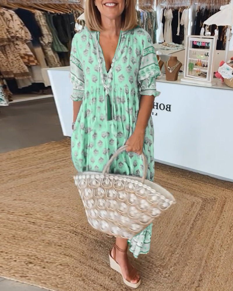 Chic Floral V-Neck Dress with Flattering Fit and Flowing Design