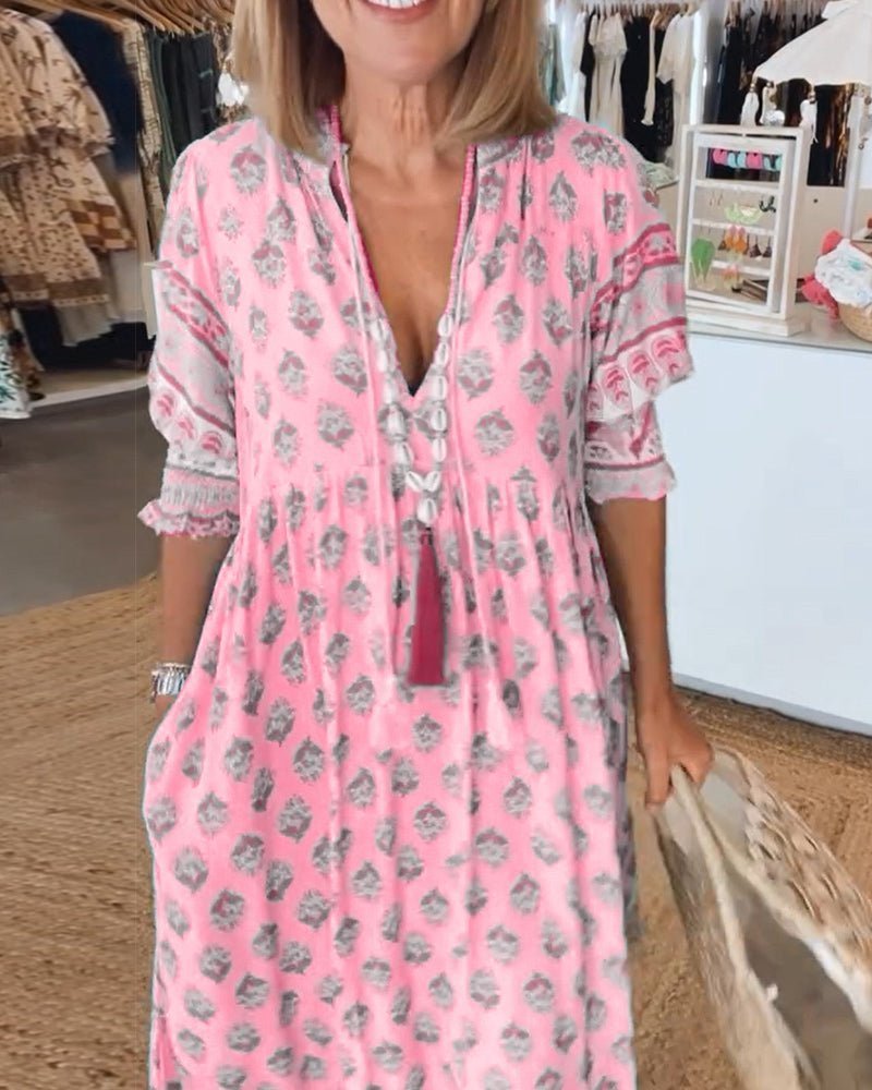 Chic Floral V-Neck Dress with Flattering Fit and Flowing Design