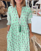 Chic Floral V-Neck Dress with Flattering Fit and Flowing Design
