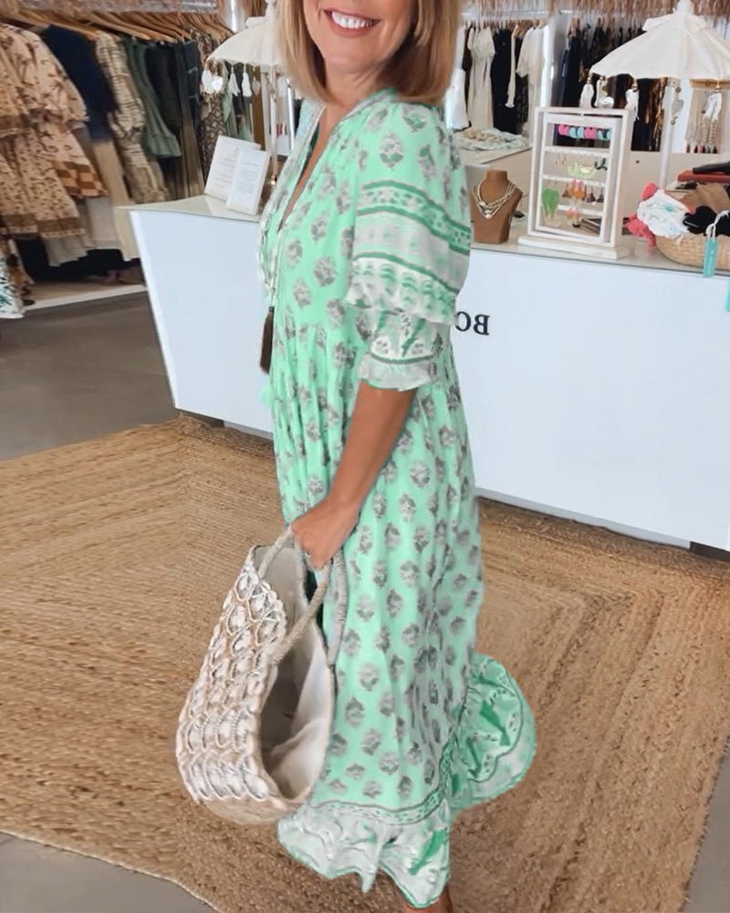 Chic Floral V-Neck Dress with Flattering Fit and Flowing Design