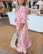 Chic Floral V-Neck Dress with Flattering Fit and Flowing Design