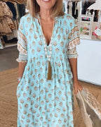 Chic Floral V-Neck Dress with Flattering Fit and Flowing Design
