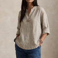 Relaxed Linen V-Neck Blouse with Button Detail and Three-Quarter Sleeves